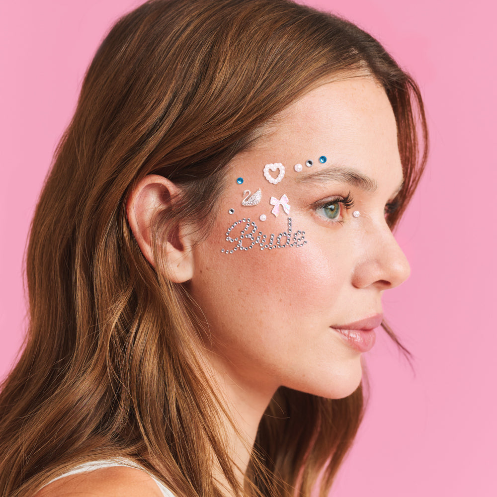 Woman with face stickers on a pink background