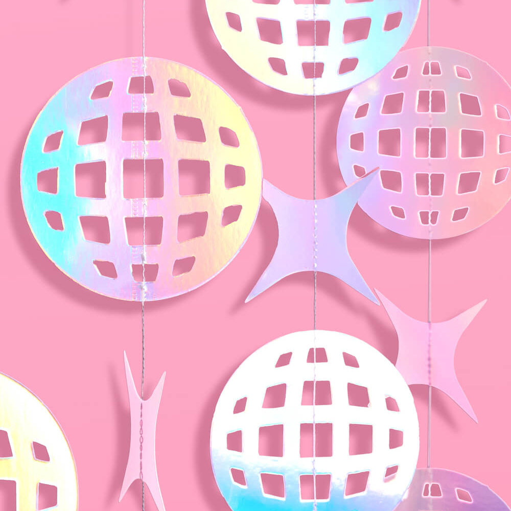 Decorative paper balls with a lattice pattern on a pink background