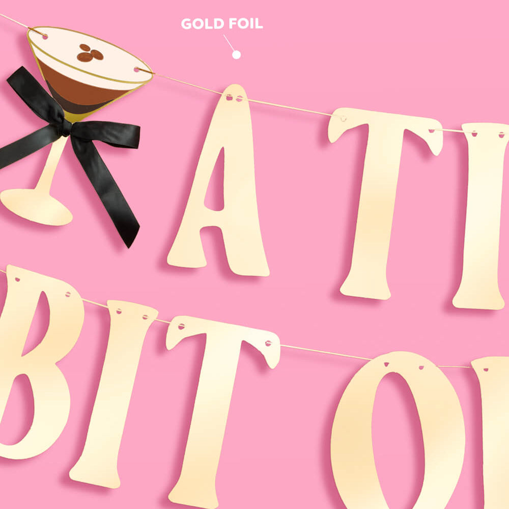 Decorative banner with 'A TINY BIT OF' text and a cocktail illustration on a pink background.