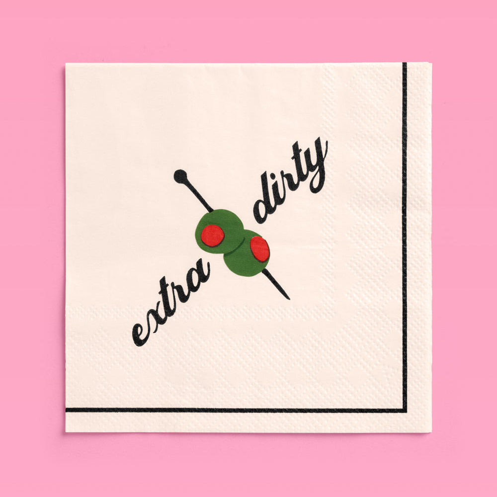 Napkin with 'extra dirty' text and olive graphic on a pink background