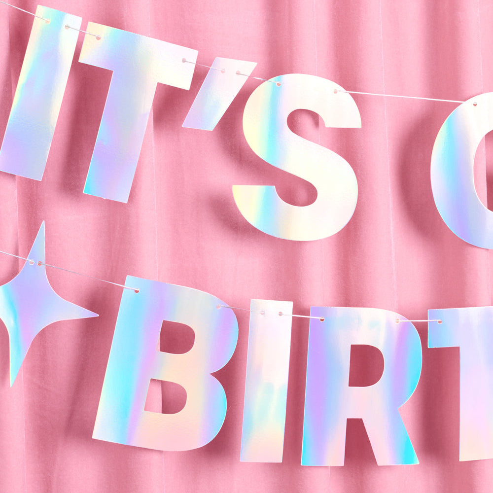 Iridescent 'It's my birthday' banner on a pink background