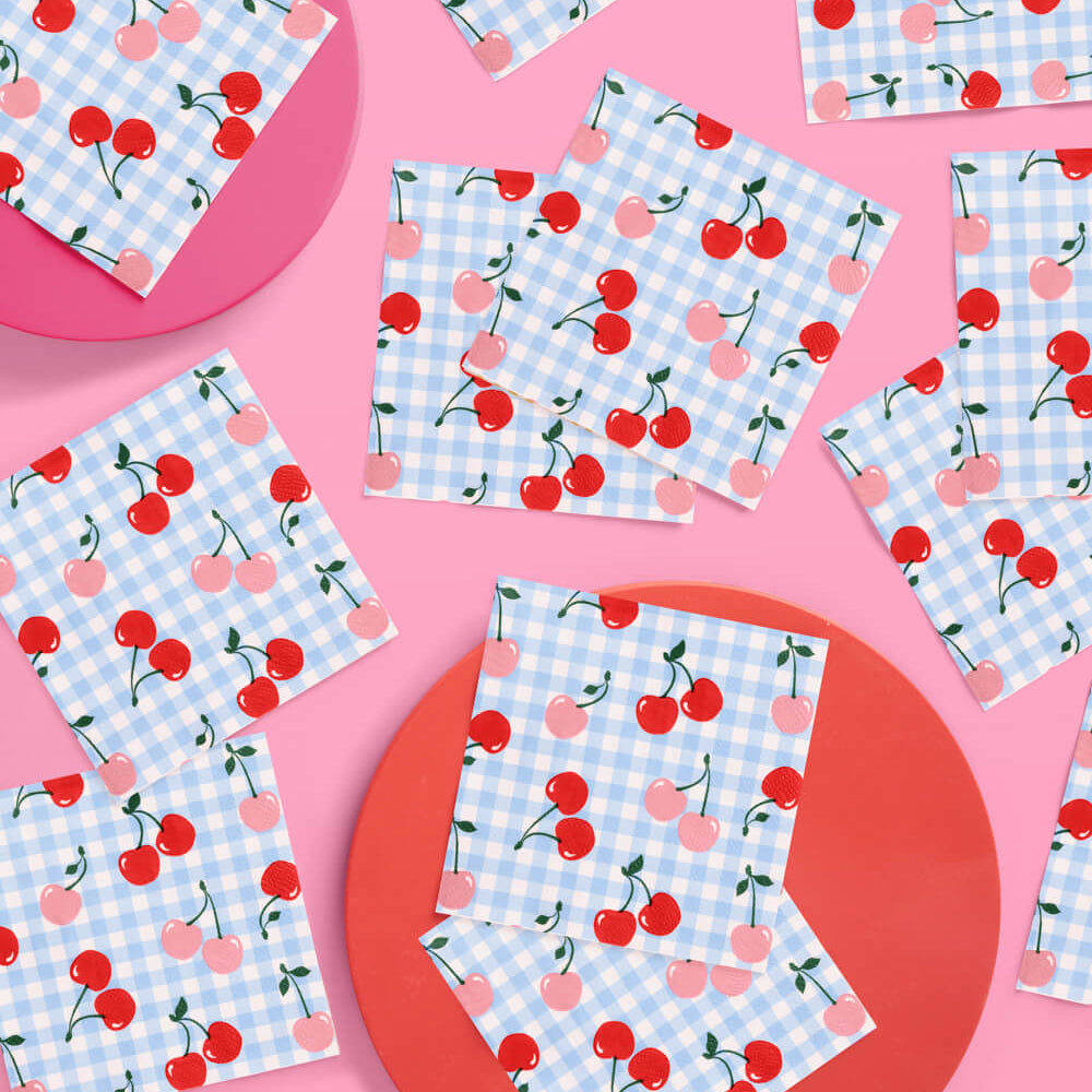 Napkins with cherry and checkered pattern on a pink background