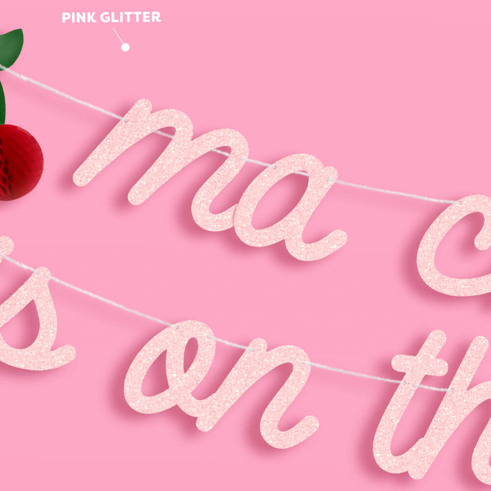 Pink glittery banner with 'ma is on the' text on a pink background