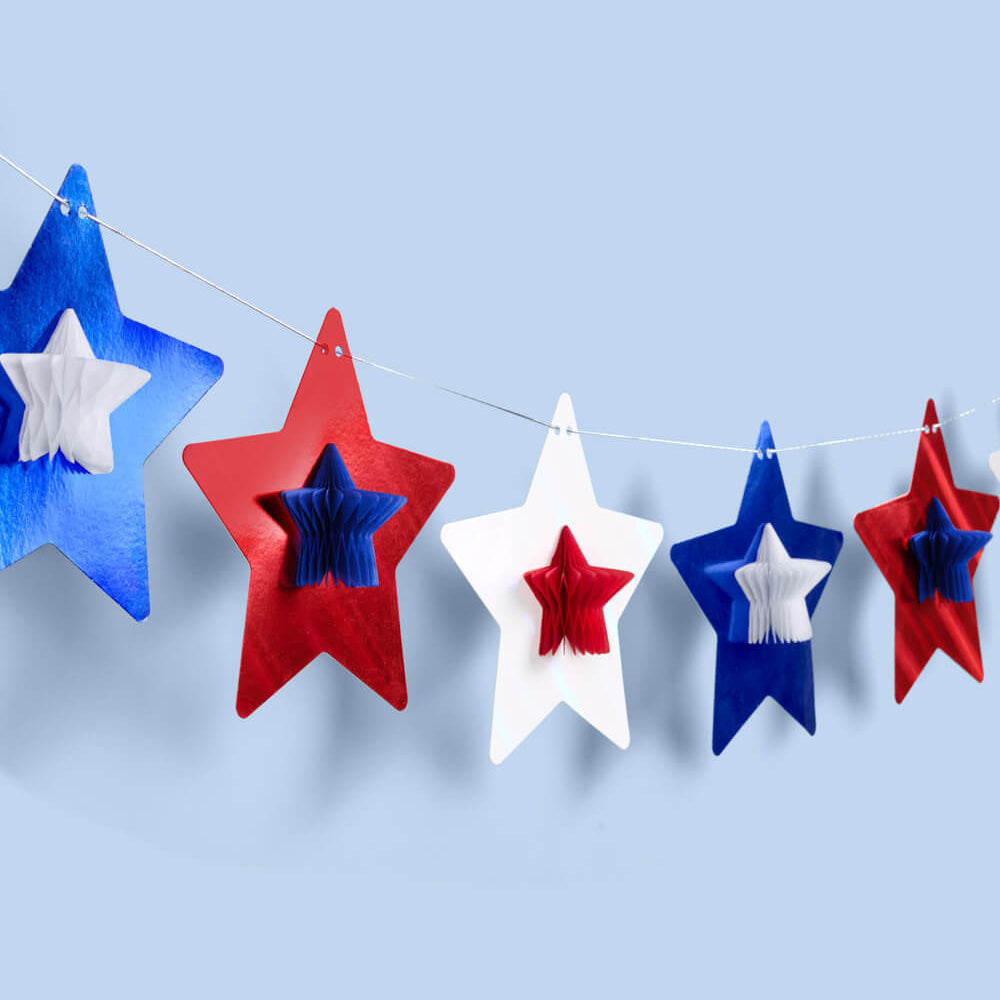 Decorative stars in red, white, and blue on a light blue background