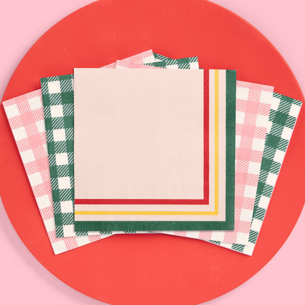 Stack of patterned paper sheets on a red circular background