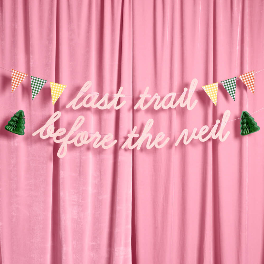 Pink curtain with decorative text and flags on a pink background