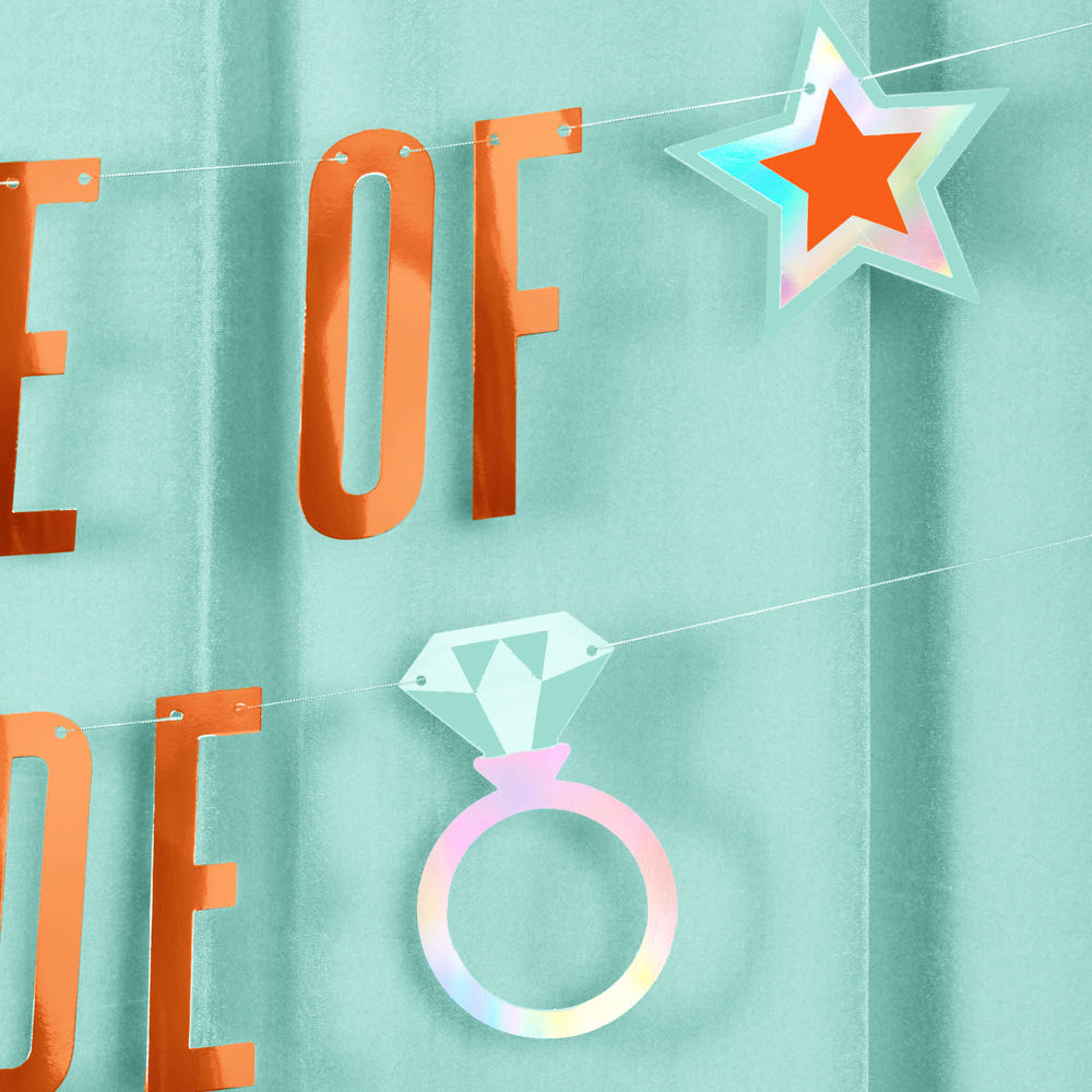 Decorative banner with 'life of a bride' text and star and ring designs on a light blue background
