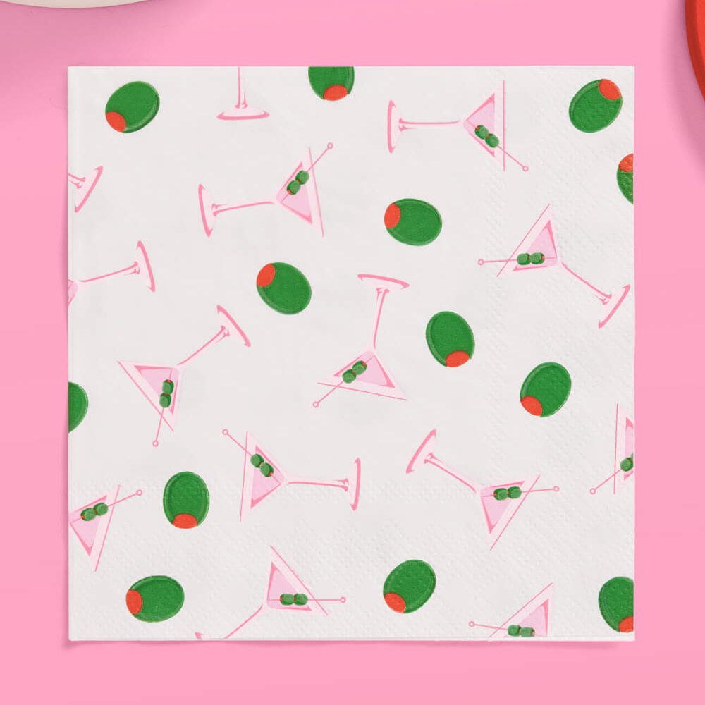 Patterned napkin with cocktail design on a pink background