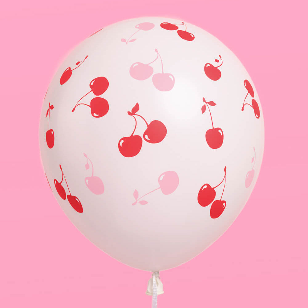 Balloon with cherry pattern on a pink background