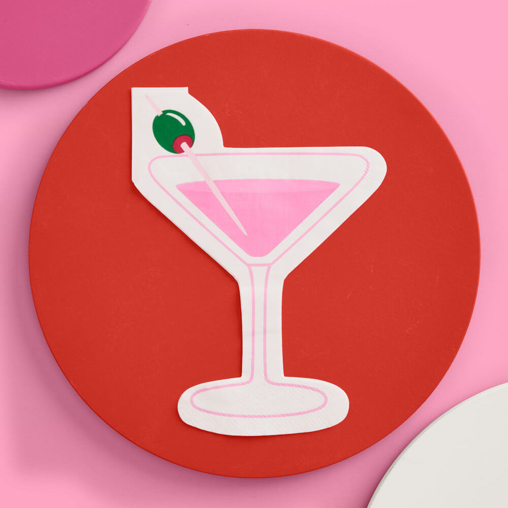 Die cut martini glass napkin with pink cocktail design and olive garnish