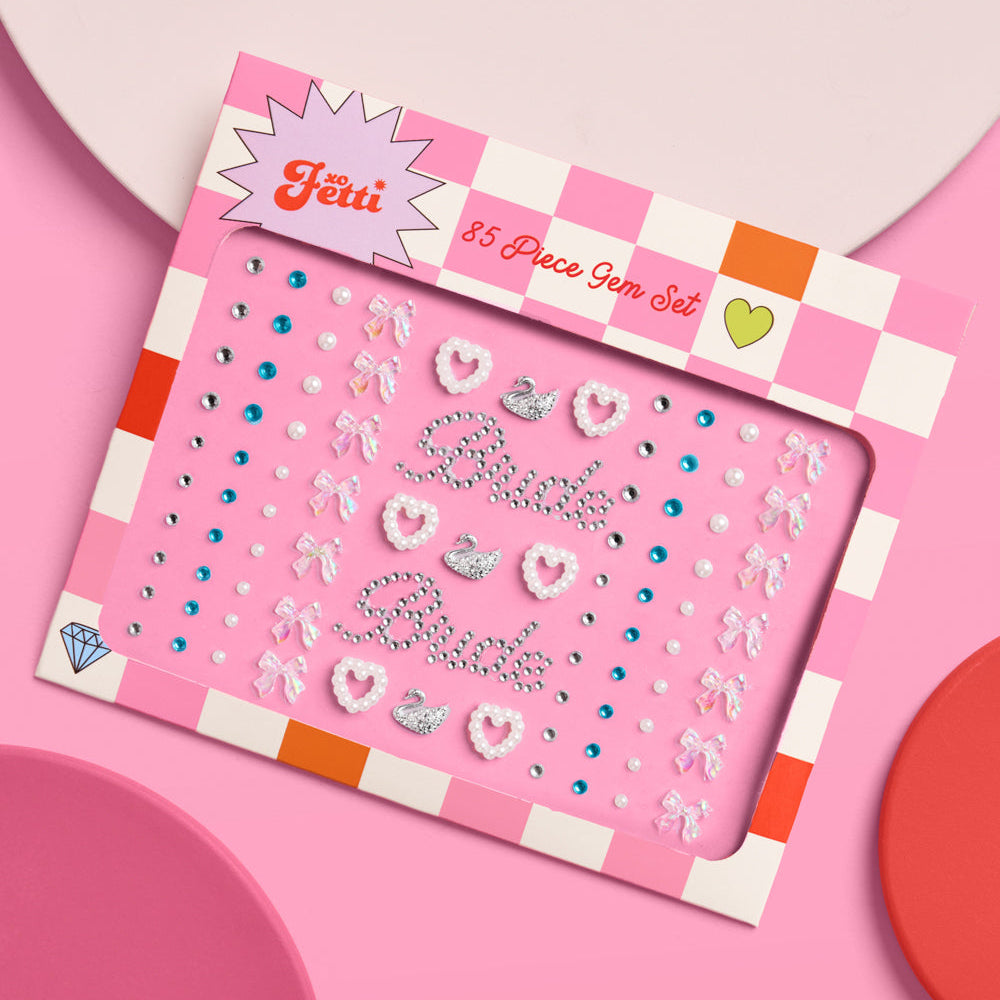 Pink sticker book with decorative elements on a pink background