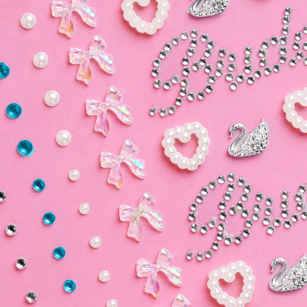 Decorative accessories including bows, hearts, and swans on a pink background with 'Brides' text.