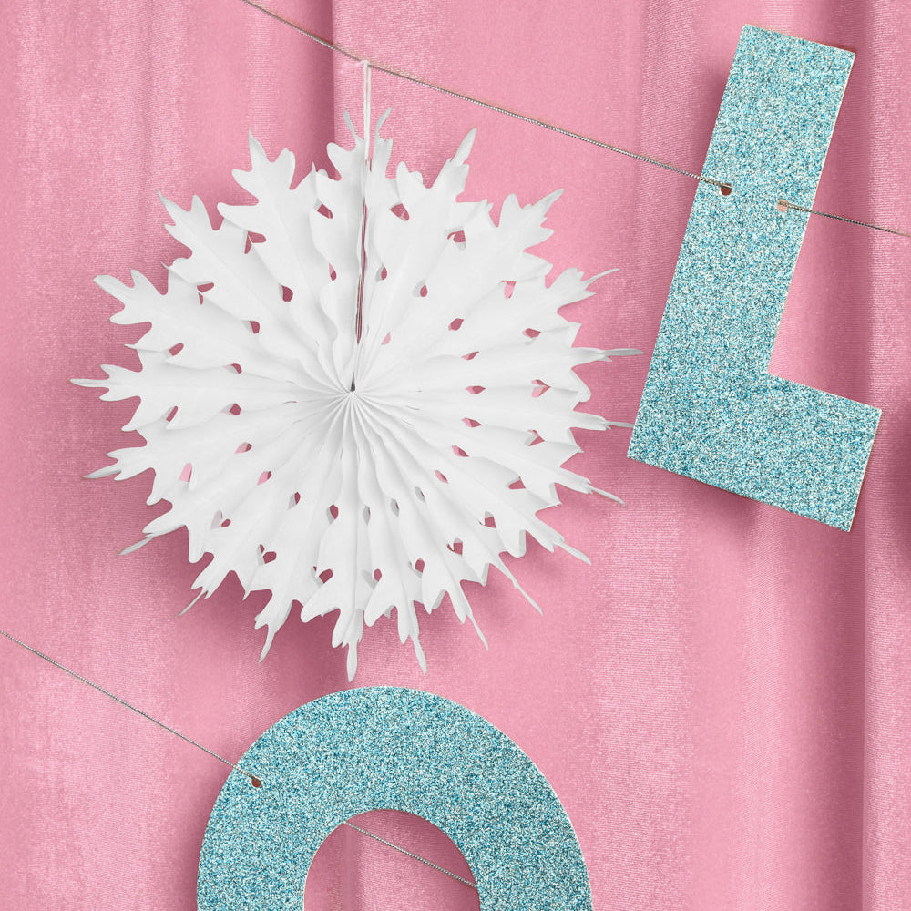 Decorative letters 'L' and 'Q' with a white paper fan on a pink background