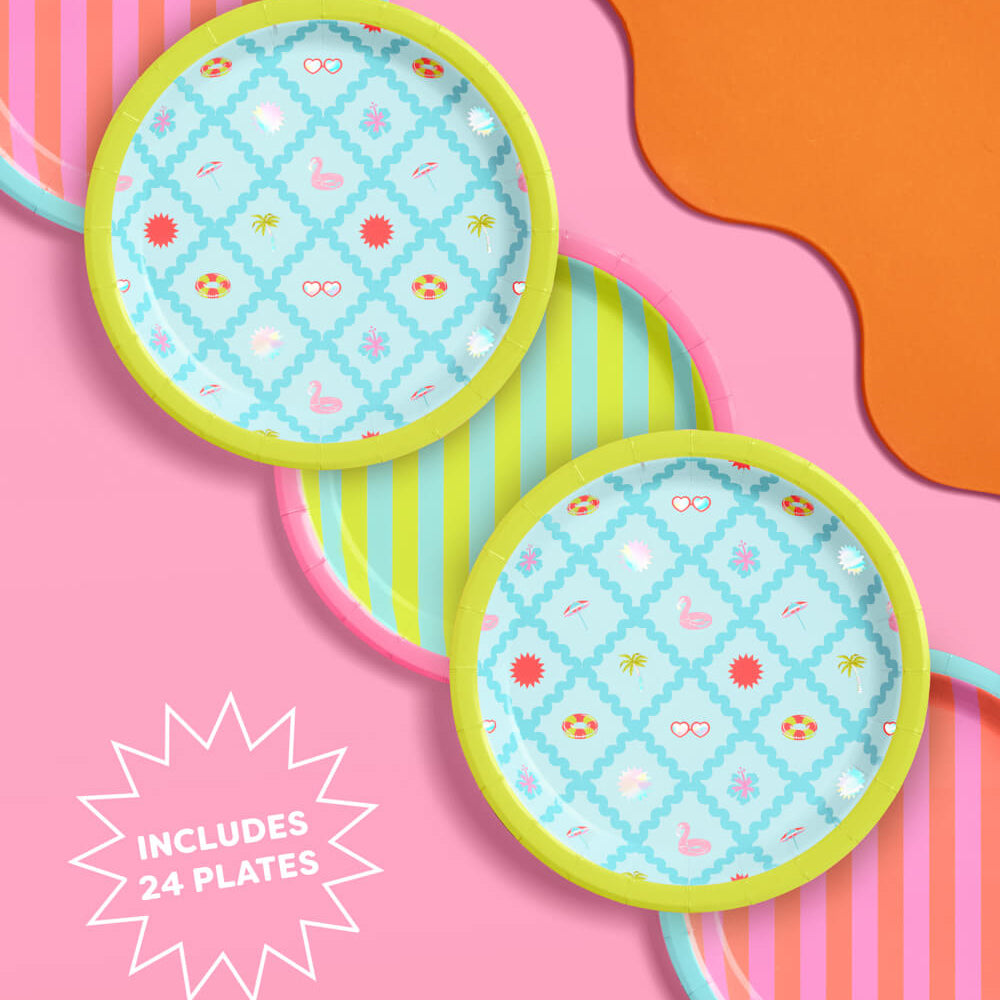 Set of colorful plates with patterns on a vibrant pink and orange background
