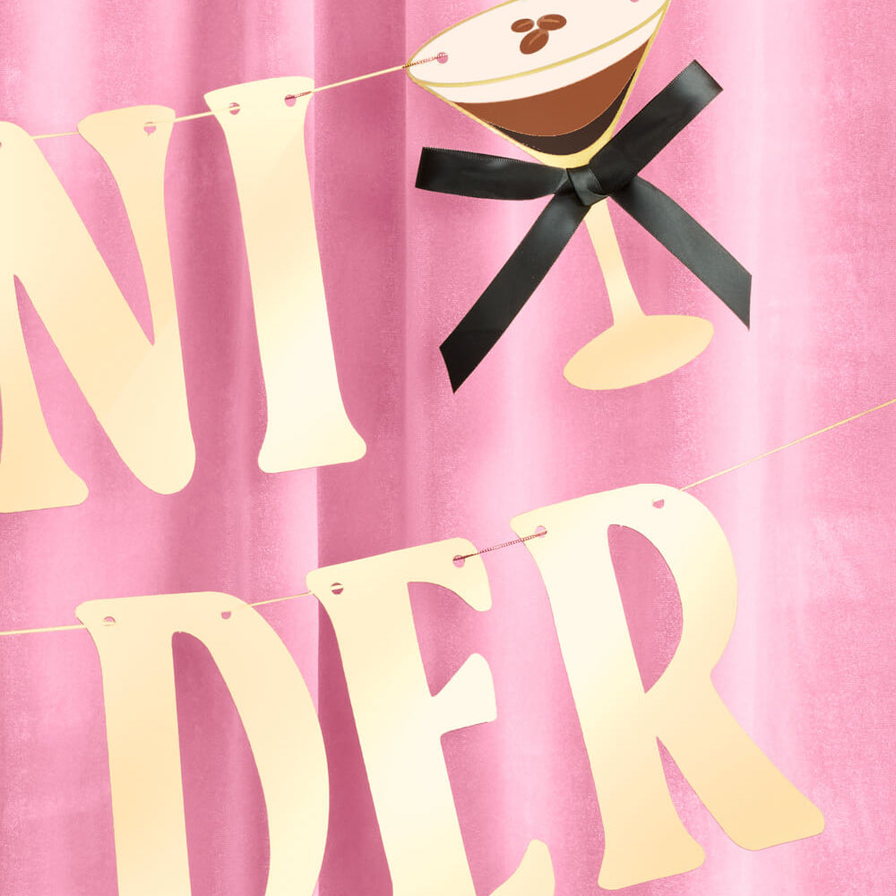 Decorative banner with 'A Tini Bit Older' on a pink background