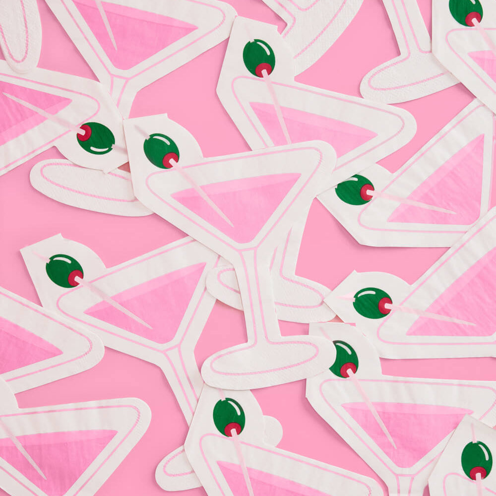 Die cut martini glass napkin with pink cocktail design and olive garnish