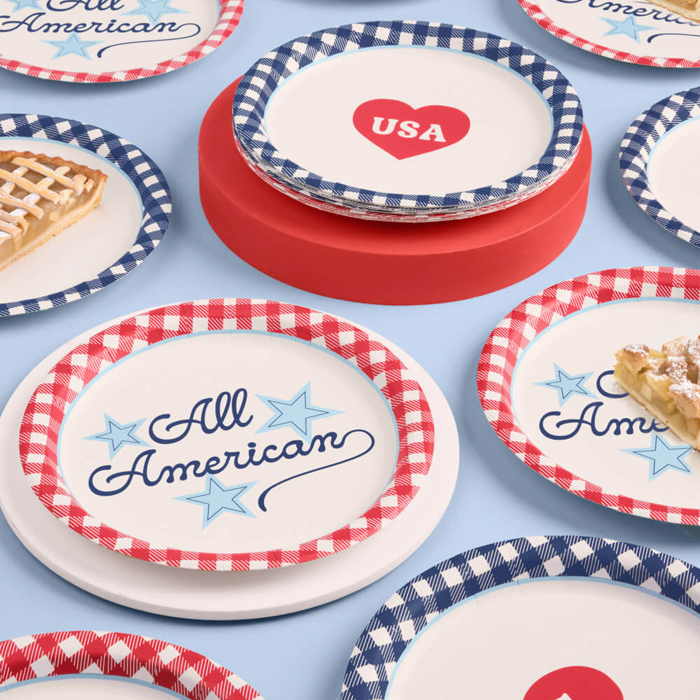 Set of decorative plates with 'All American' and 'USA' text on a blue background