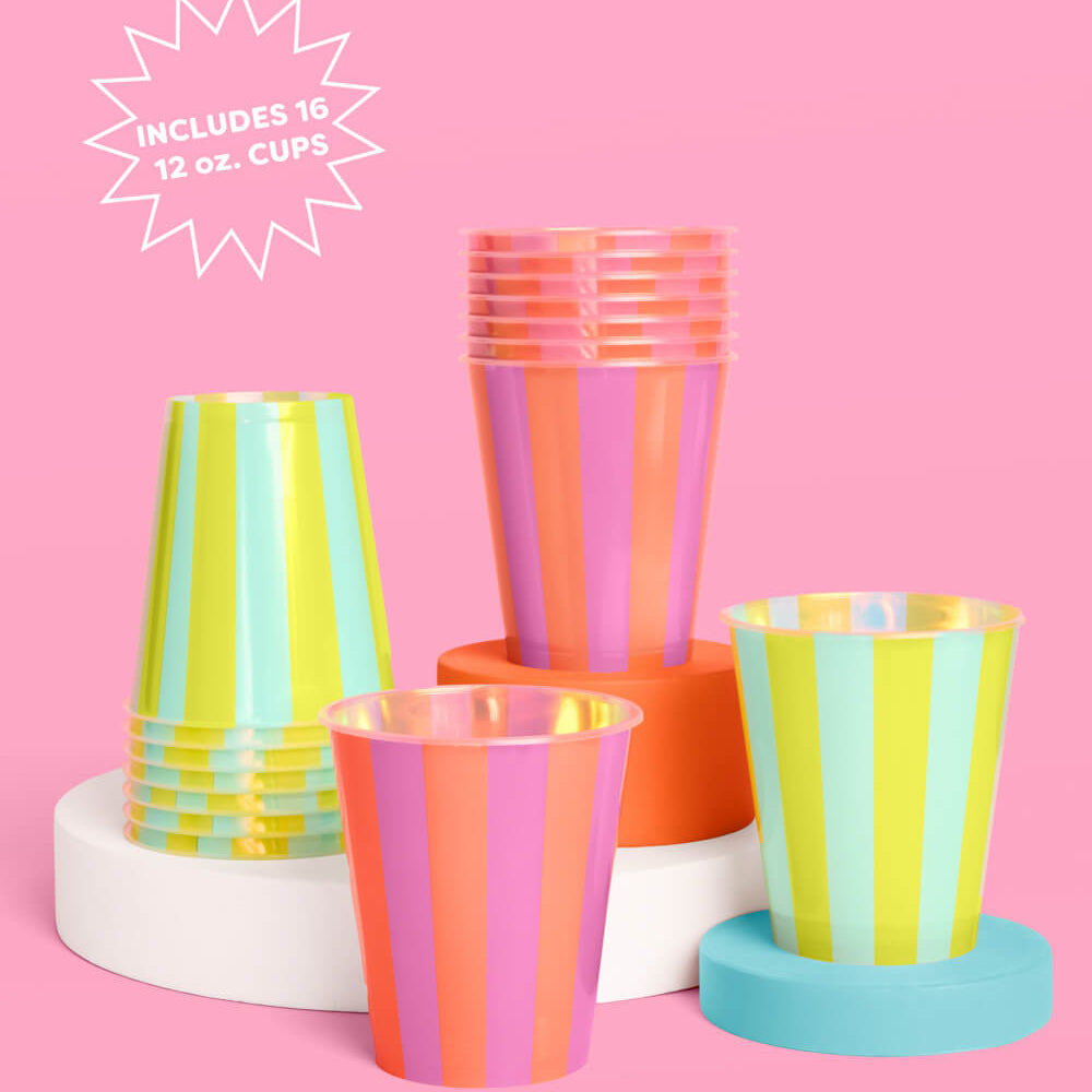 Colorful striped plastic cups on a pink background with text indicating quantity.