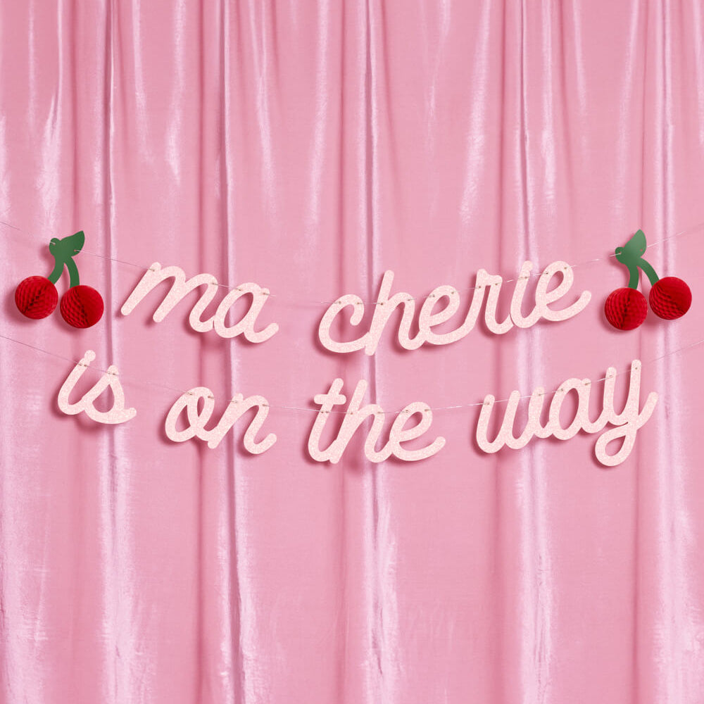 Pink background with 'ma chérie is on the way' text and cherry decorations.