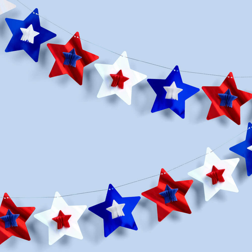 Star-shaped decorations in red, white, and blue on a light blue background