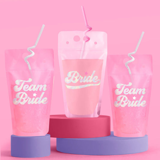 Pink cups with 'Team Bride' text on a pink background