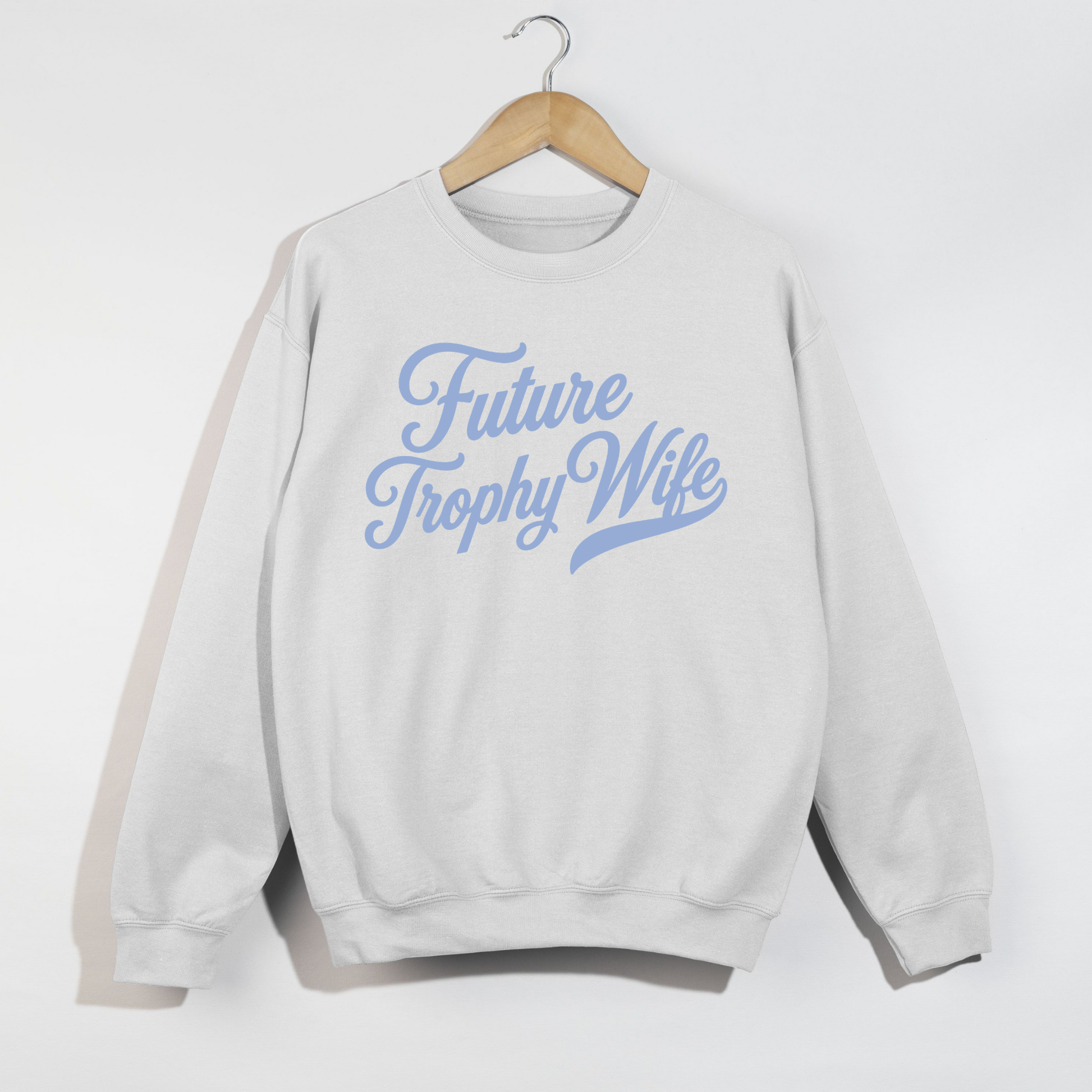 White Future Trophy Wife crewneck sweatshirt with light blue script on hanger