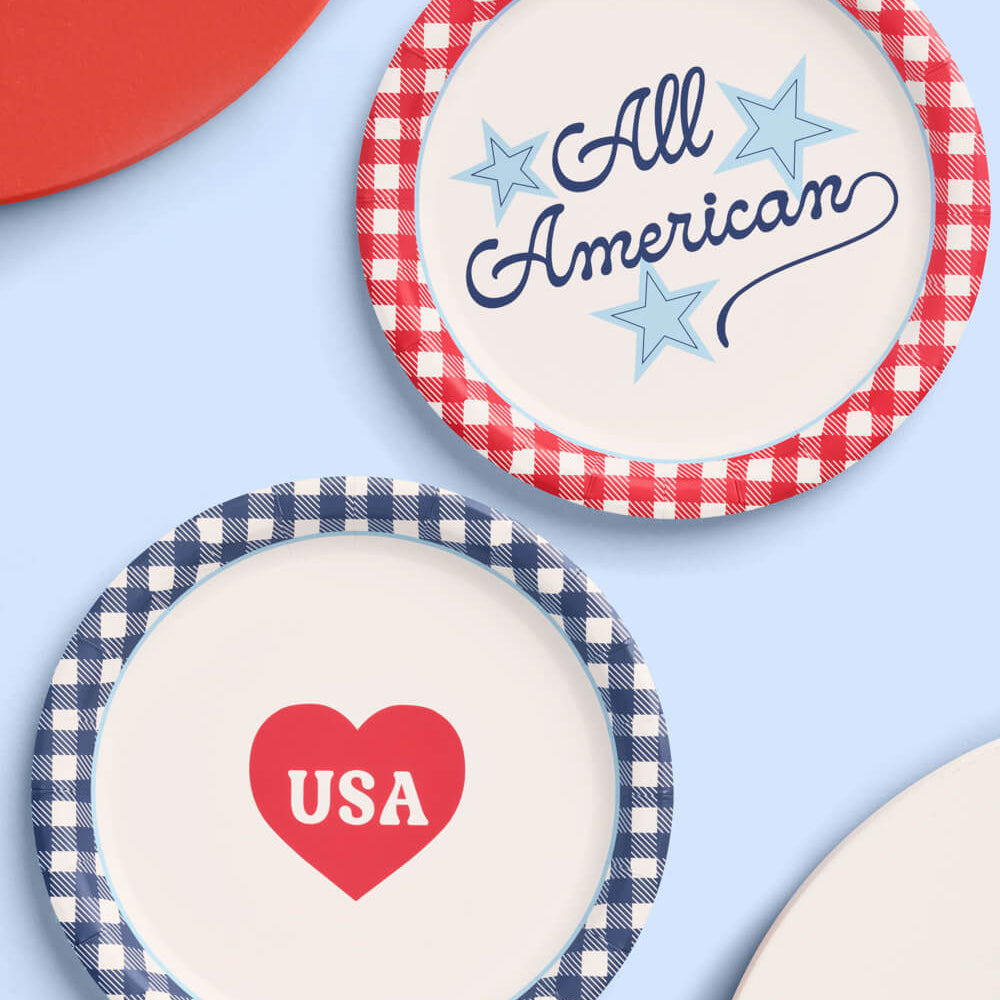 Two decorative plates with 'All American' and 'USA' text on a blue background