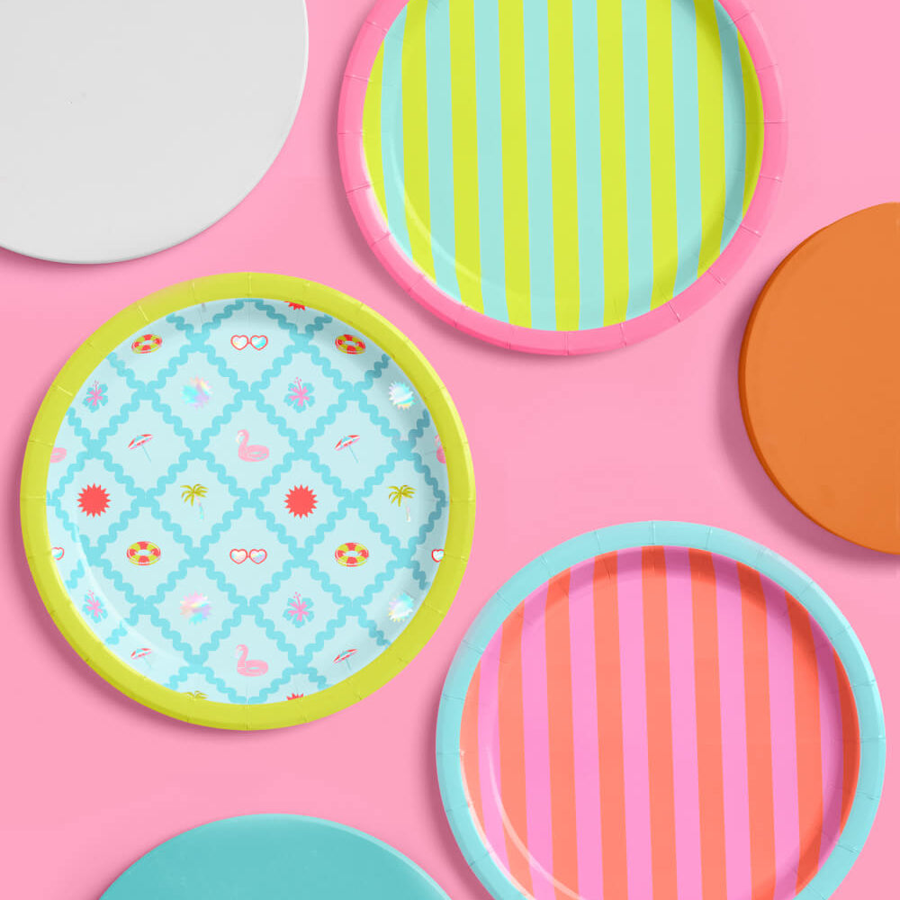 Colorful patterned plates on a pink background