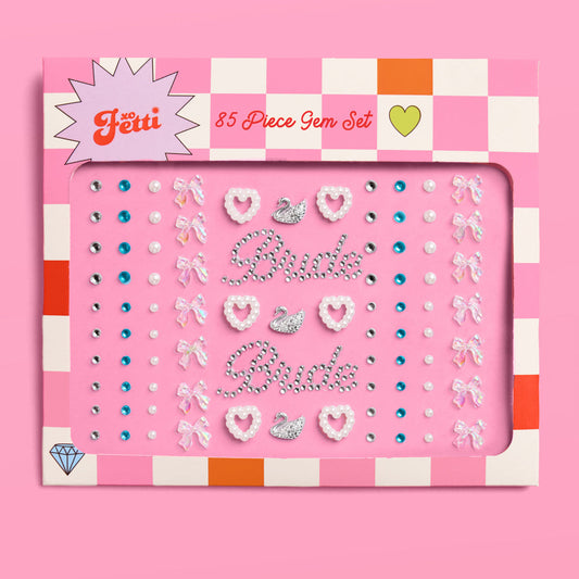 85-piece gem set packaging with 'Fetti' branding on a pink background