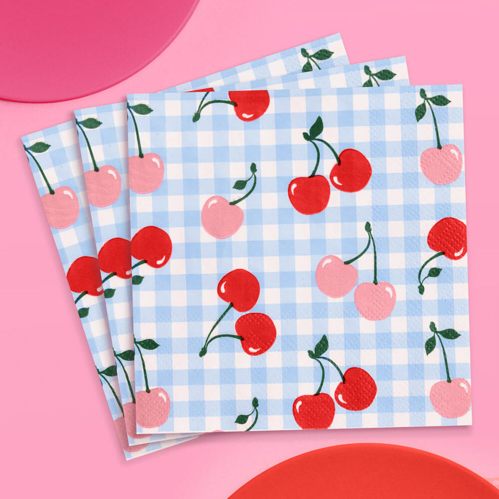 Set of three napkins with cherry pattern on a pink background