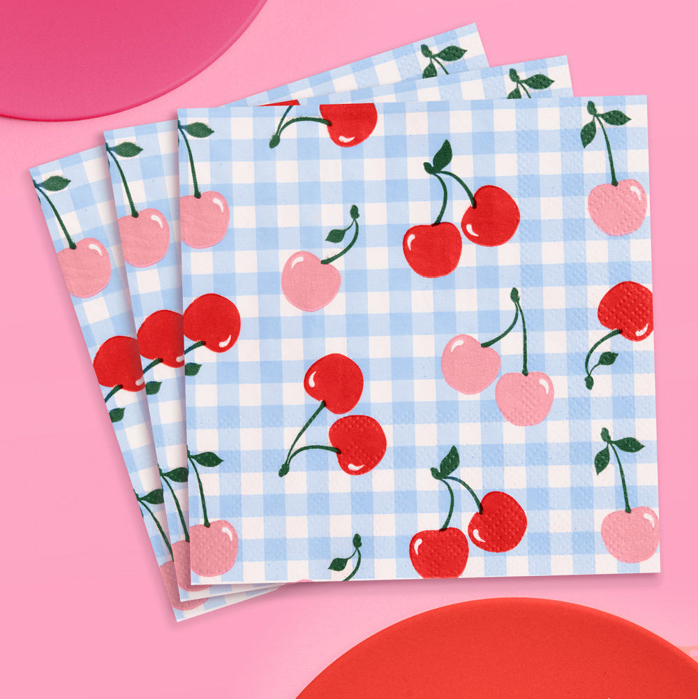 Set of three napkins with cherry pattern on a pink background
