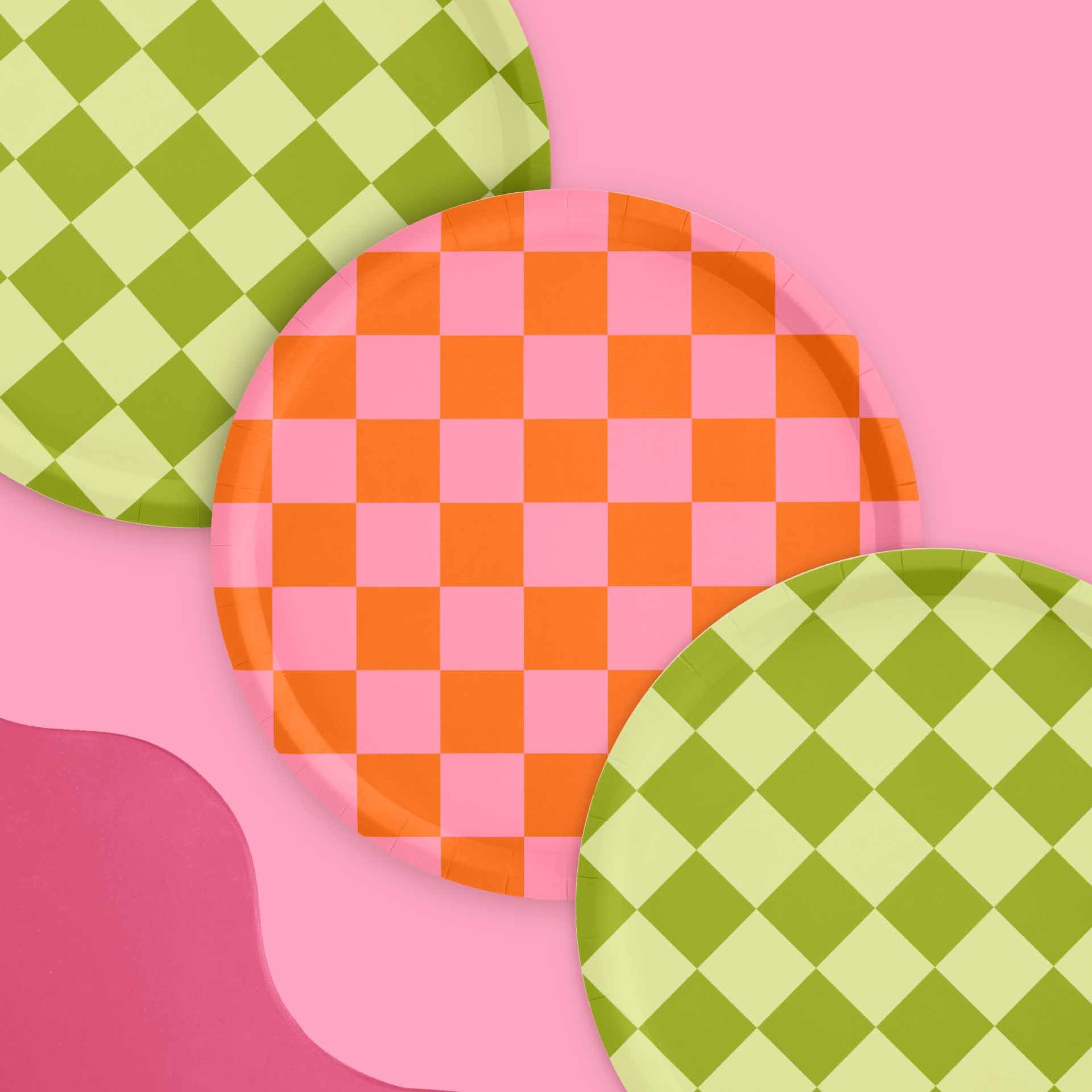 Three colorful checkered plates on a pink background