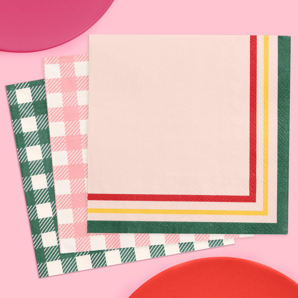 Three colorful napkins on a pink background