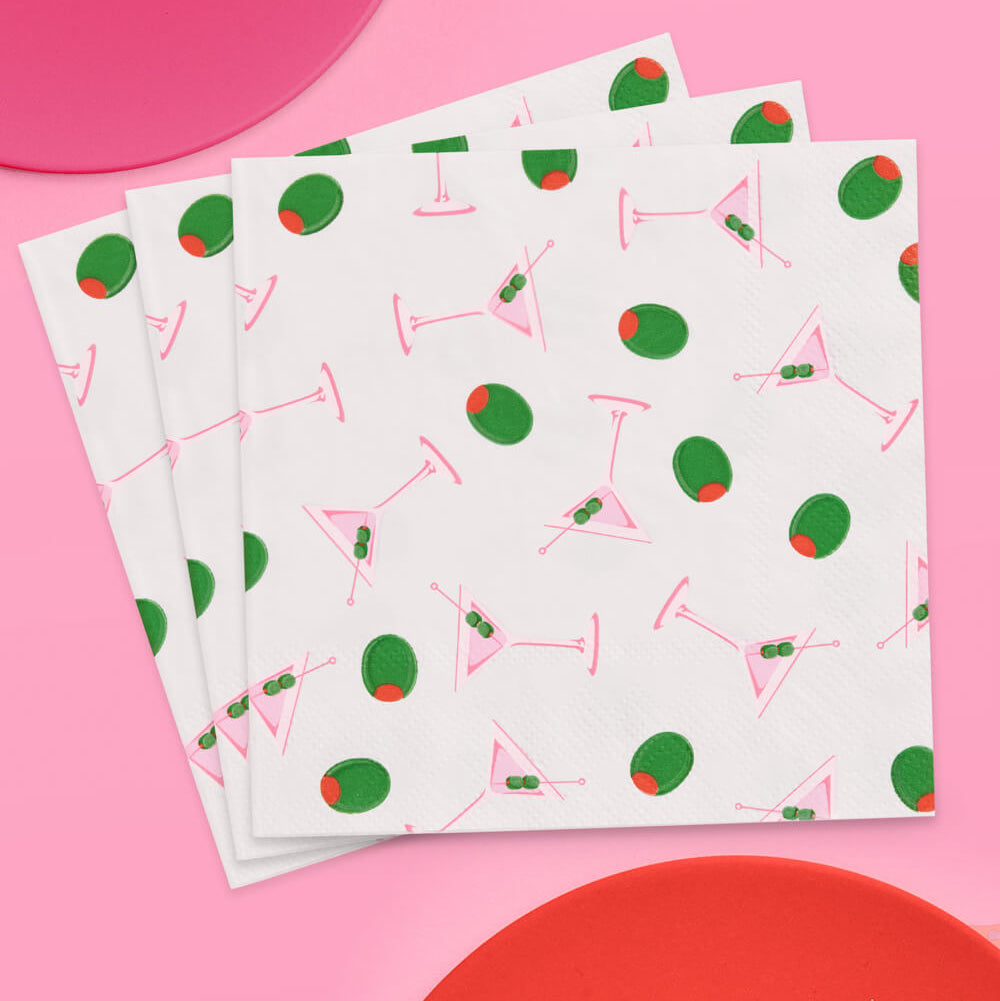 Stack of paper with cocktail pattern on a pink background