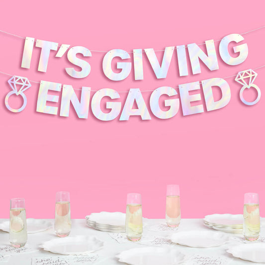 Decorative banner with 'It's Giving Engaged' text on a pink background, with tableware and drinks below.