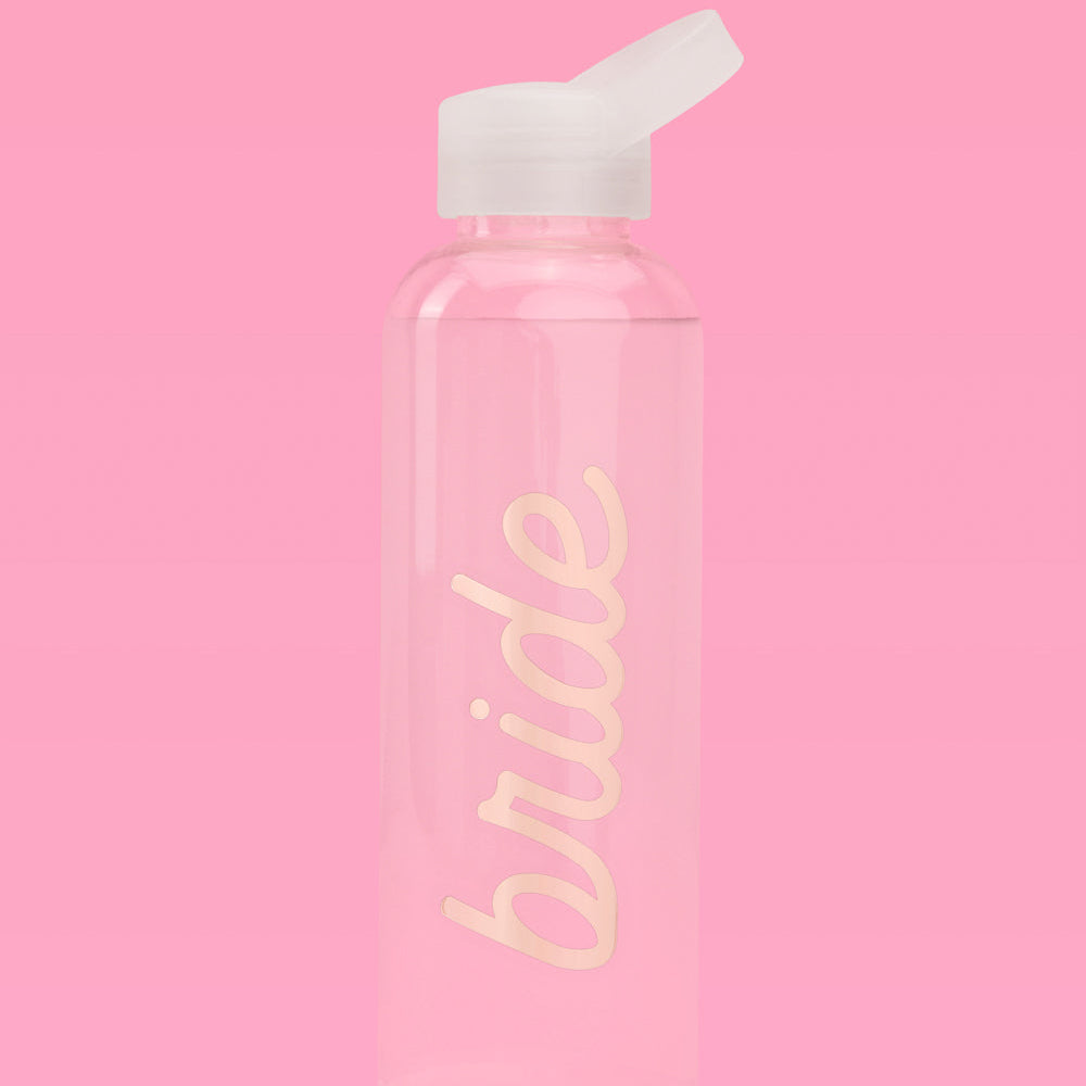 Clear water bottle with 'bride' text on a pink background