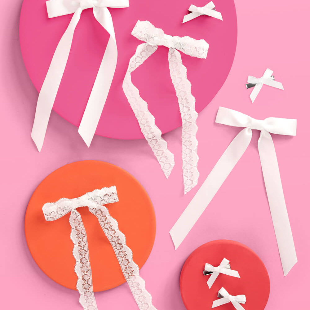 Decorative ribbons on colorful circular backgrounds with a pink and orange color scheme.
