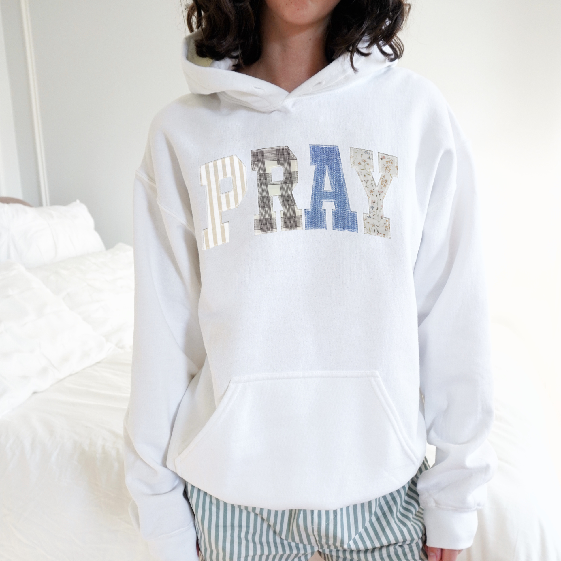 Sand PRAY hoodie flat lay showing unisex fit and hood detail