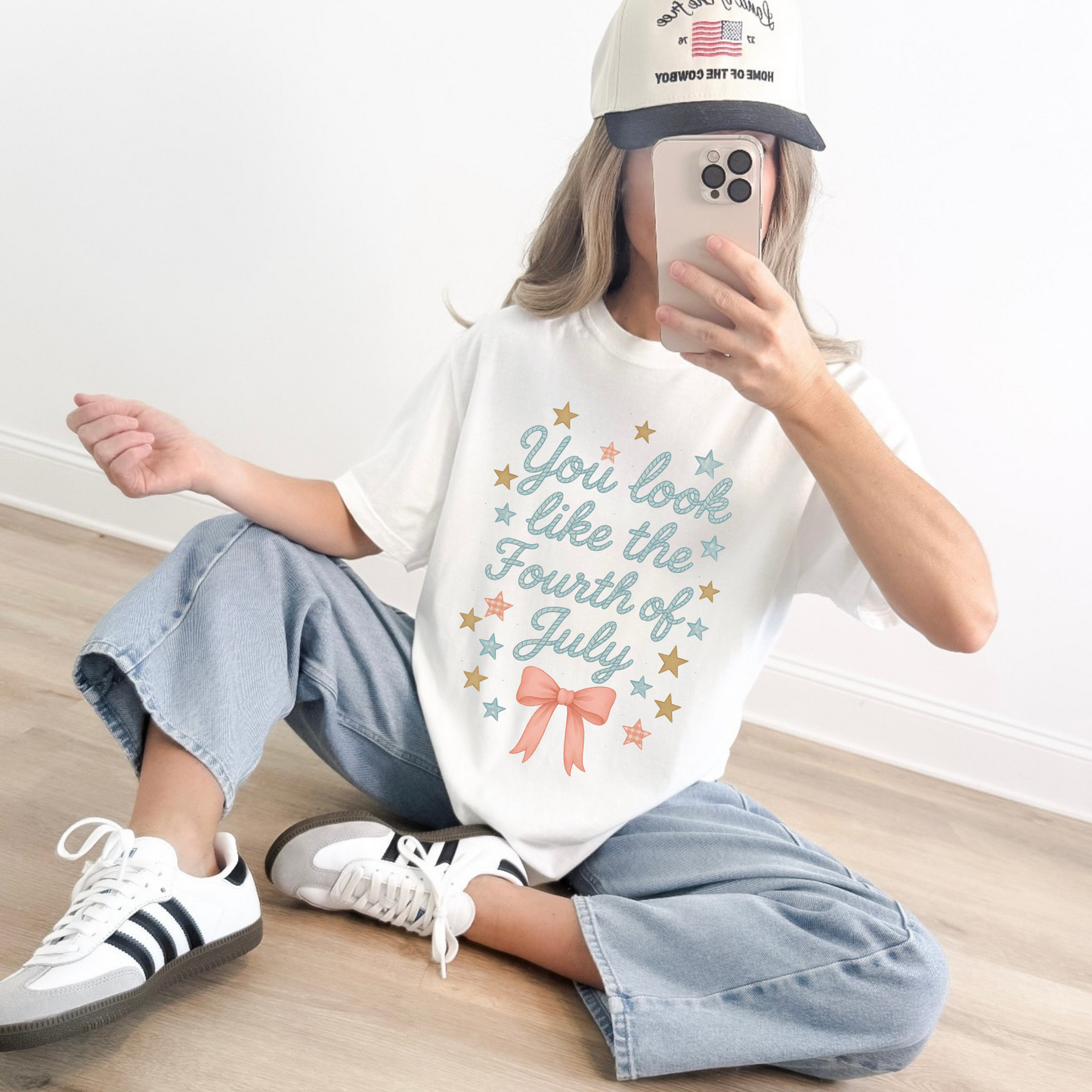 Woman wearing You Look Like the Fourth of July shirt styled with jeans and sneakers