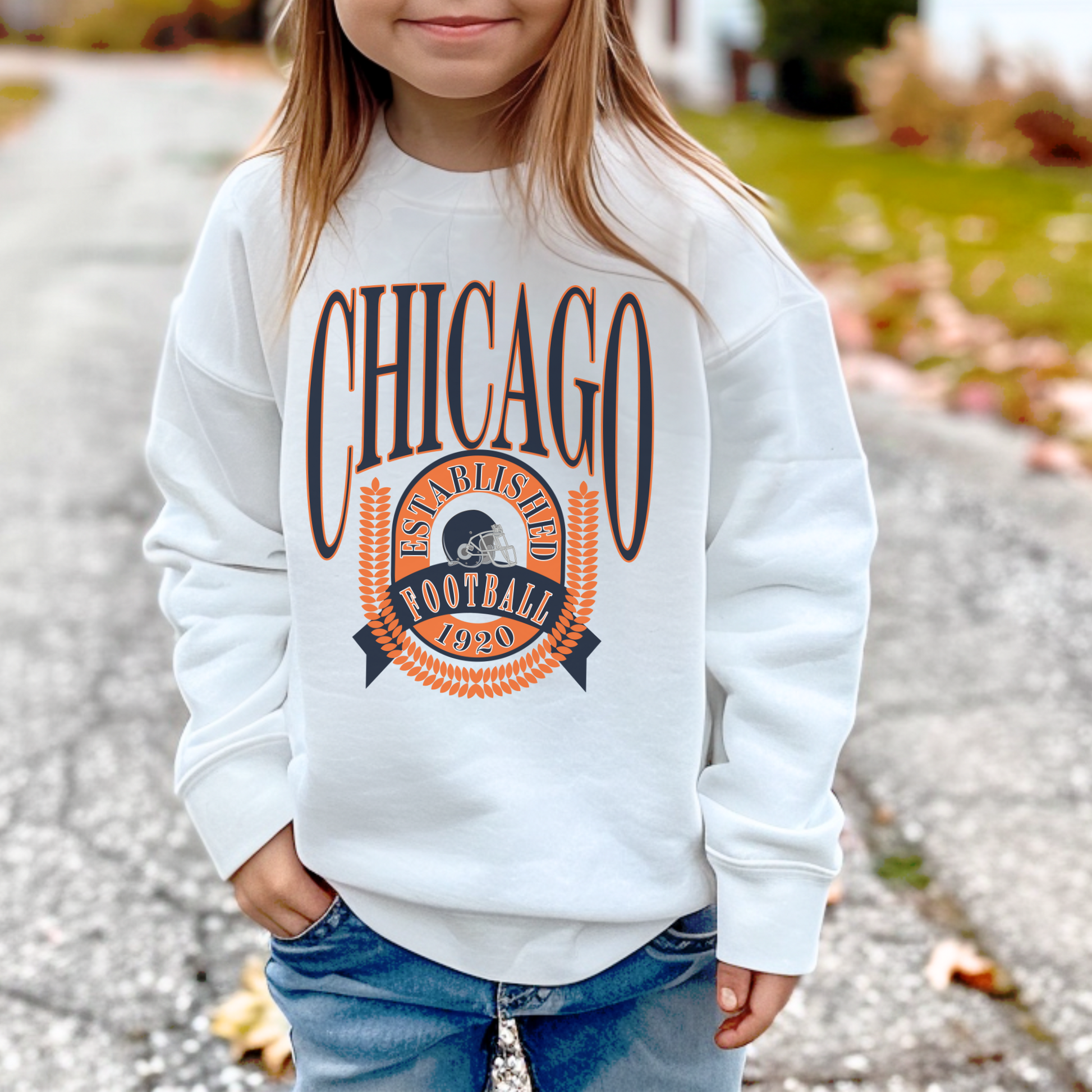 Toddler wearing Chicago Football 1920 crewneck sweatshirt in white, unisex kids football apparel