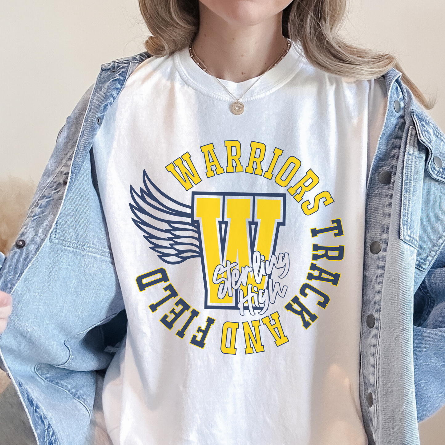 Sterling High School Warriors Track and Field spirit shirt layered with denim jacket