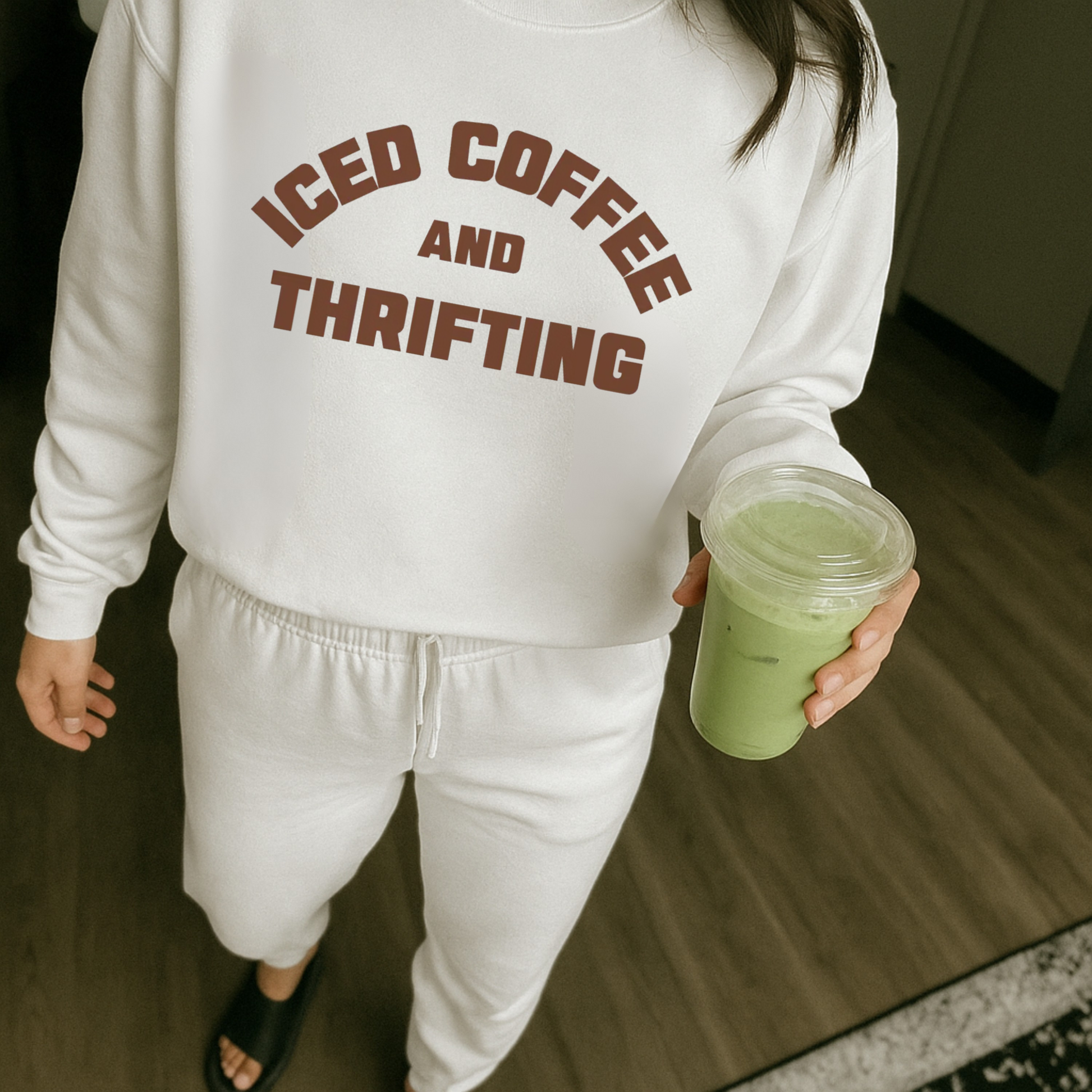 White iced coffee and thrifting sweatshirt worn with matching lounge set and iced drink