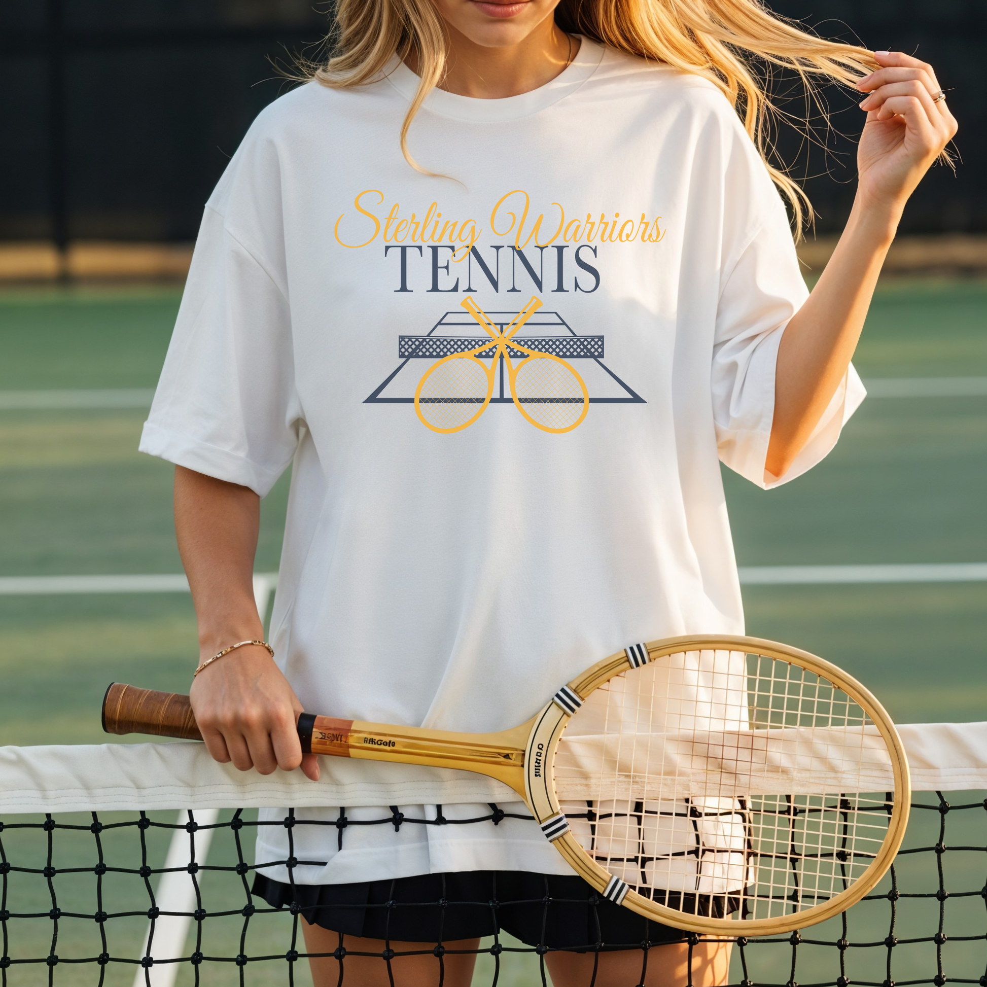 Model wearing white Sterling Warriors Tennis graphic tee holding tennis racket on court