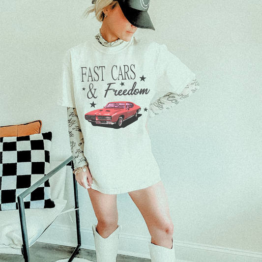 White Fast Cars & Freedom graphic tee styled with white boots and layered long sleeve featuring red vintage muscle car design.