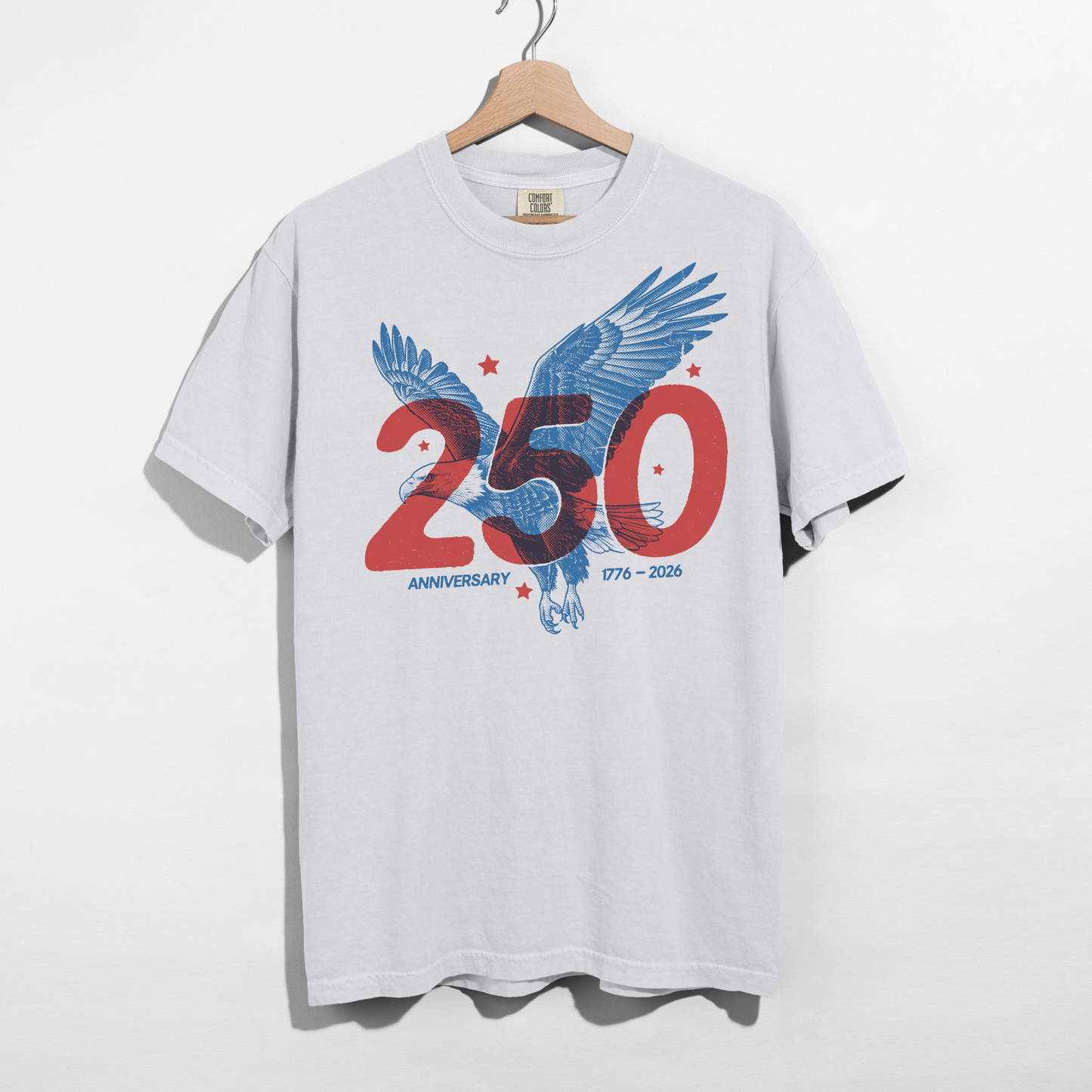 White t-shirt with an eagle graphic and '250 Anniversary' text on a hanger against a white background