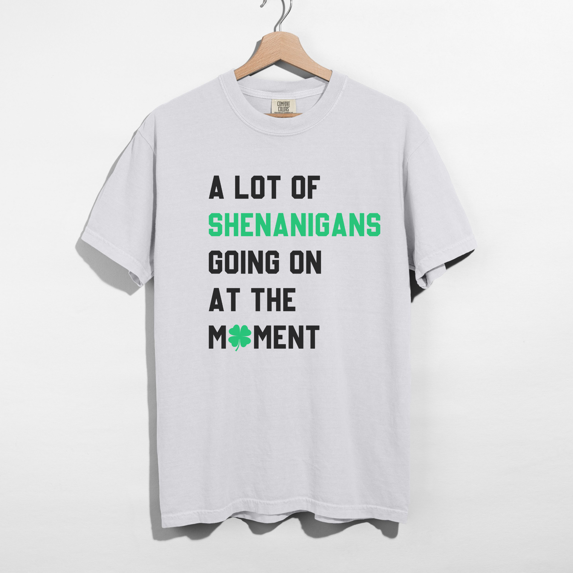 White St Patrick’s Day Shenanigans graphic shirt with bold black and green lettering