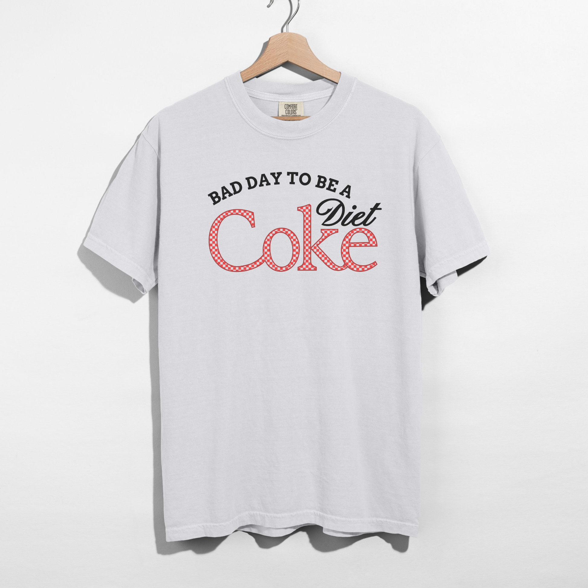 White Comfort Colors graphic t-shirt with “Bad Day to Be a Diet Coke” retro text