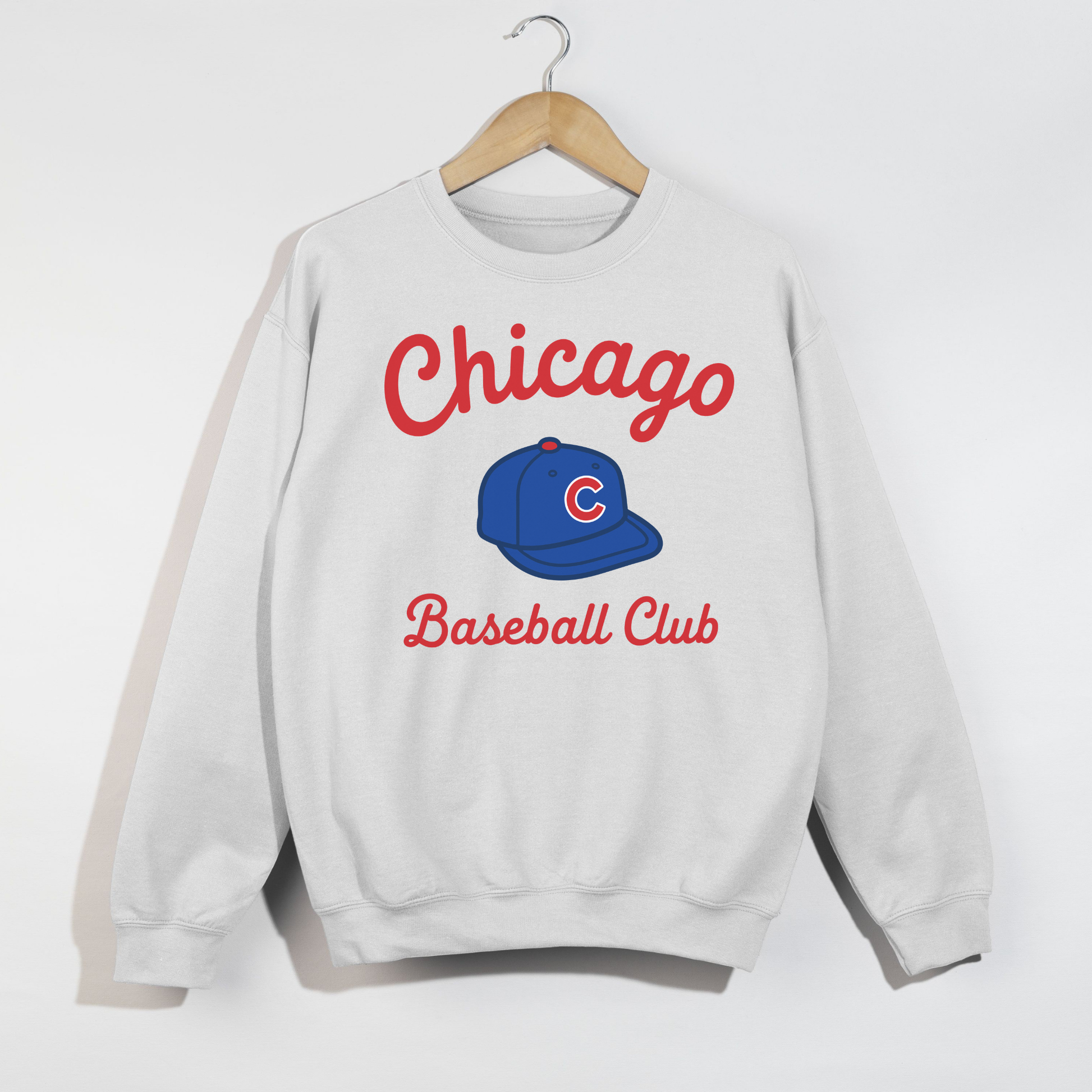 White Chicago Baseball Club sweatshirt flat lay featuring retro sporty typography and baseball hat graphic