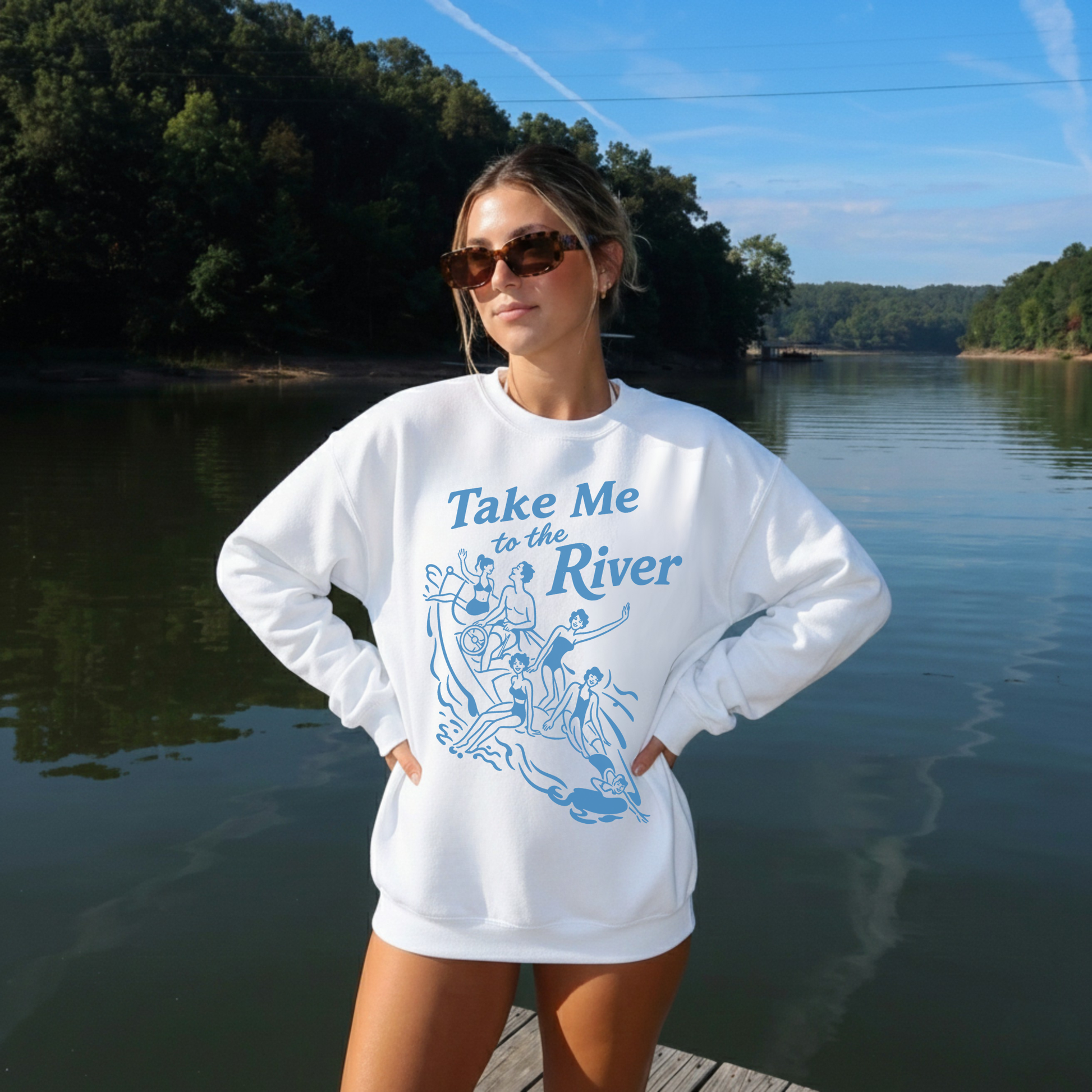 White oversized river sweatshirt styled at lake with sunglasses