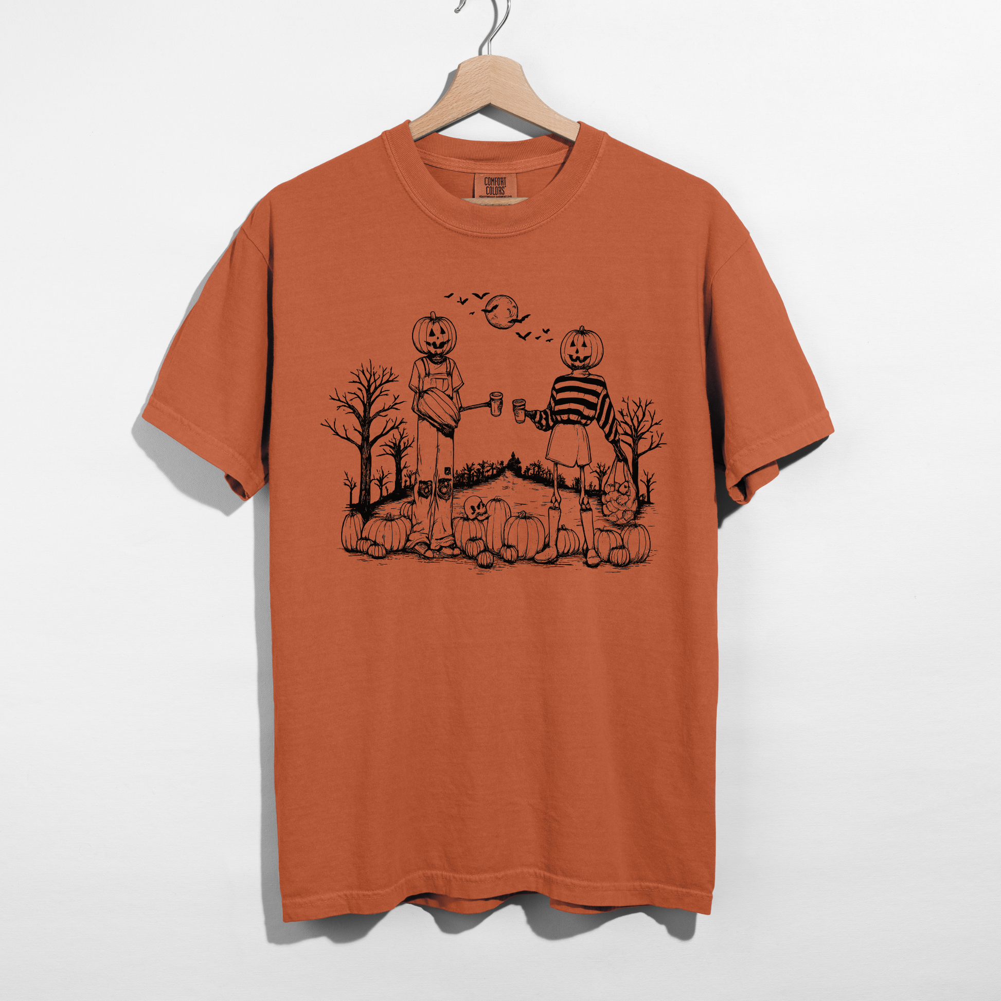 Yam orange Halloween graphic tee with vintage pumpkin patch artwork featuring pumpkin-headed friends sharing coffee.